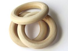 three wooden rings sitting on top of each other