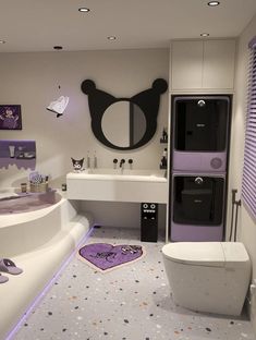 a bathroom with purple and white decor on the walls