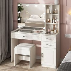 a white dressing table with mirror and stool next to a bed in a pink room