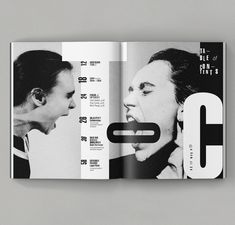 an open magazine with black and white images on it's cover, featuring two people talking