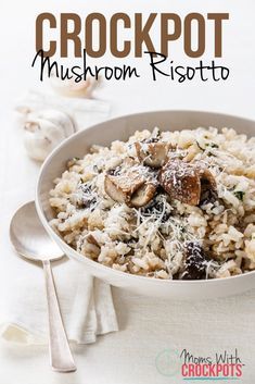 a white bowl filled with rice covered in mushrooms and parmesan