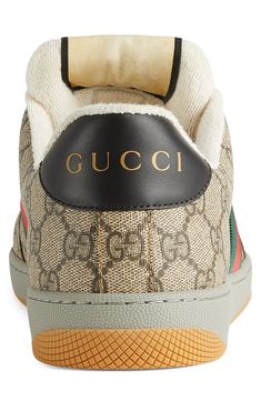 Heritage web stripes angle up the sides of a '70s-inspired, GG Supreme sneaker with enameled double-G hardware, a throwback label and a logo-stamped heel tab. Lace-up style Removable insole Textile upper/textile and leather lining/rubber sole Made in Italy Men's Designer Shoes Gucci Low-top Sneakers With Logo, Gucci Leather Sneakers With Logo, Brown Low-top Sneakers With Logo Print, Brown Sneakers With Logo Print And Round Toe, Brown Round Toe Sneakers With Logo Print, Gucci Sporty High-top Sneakers, Gucci High-top Logo Sneakers, Gucci High-top Sneakers With Logo, Brown Sneakers With Embroidered Logo For Streetwear