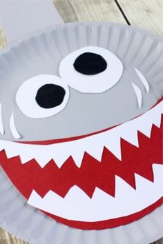 a paper plate with a monster face on it