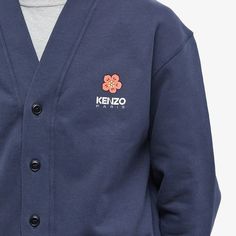 A pioneer of streetwear fashion, Kenzo creative director Nigo has created a collection highlighting the ‘Boke Flower’. A Japanese flower that creates a link between the House's heritage and Nigo's identity, it is enlarged and printed on the back of this cardigan..99% Cotton, 1% Elastane.V-Neck.Button Closure.Ribbed Trims.Front Pockets.Made in Portugal.Model is 6ft /1.82m with a 35”/88.9cm chest and is wearing a size Medium. Cotton Cardigan With Ribbed Cuffs For Streetwear, Crew Neck Cotton Cardigan For Streetwear, Cotton Crew Neck Cardigan For Streetwear, Trendy Cotton Cardigan For Streetwear, Flower Cardigan, Kenzo Paris, Japanese Flower, Japanese Flowers, Creative Director