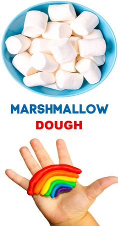 marshmallows in a blue bowl with the words dough on it and a hand holding