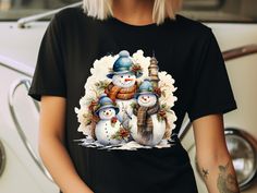 "Our playful snowman family graphic takes center stage, adding a touch of lighthearted charm to your ensemble. The \"Funny Snowman Family T-Shirt\" is designed to bring joy to your winter wardrobe, making it an ideal choice for those who appreciate a good laugh and a comfy fit. ✨ K E Y * F E A T U R E S ✨ 👕 True-to-size fit and the vivid colors, guaranteed to withstand washes without fading. 💫 Side-seamed for increased durability, never tubular 🫧 Machine washable: wash cold, inside-out. Tumble dry low or hang dry for best results. 🇺🇸 Proudly printed in the USA and the blend of high-quality materials ensures longevity and resilience against wear and tear. ✨ H O W * T O * O R D E R ✨ 1. Refer to our photos for sizing and color options. 📷 2. From the drop-down menus, choose your preferr Watercolor Snowman, Family Graphic, Motivational Hoodies, Winter Tees, Snowman Shirt, Funny Snowman, Snowman Family, Winter T Shirts, Funny Sweaters