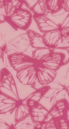 many pink butterflies are flying in the air