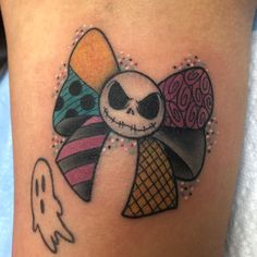 a cartoon character tattoo on the side of a woman's leg with an ice cream cone