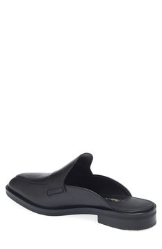 This loafer-style mule in smooth leather is a modern essential for casual and office looks. Leather upper, lining and sole Imported Classic Flat Slip-ons For Business, Leather Closed Toe Slip-ons For Business Casual, Office Slip-ons With Rubber Sole, Luxury Slip-ons With Leather Sole For Work, Luxury Leather Sole Slip-ons For Work, Calf Leather Pointed Toe Slip-ons For Work, Formal Calf Leather Slip-ons For Spring, Modern Calf Leather Loafers For Business Casual, Modern Formal Slip-ons With Leather Lining