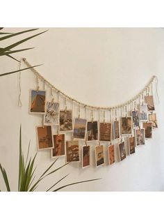 a wall hanging with many pictures on it