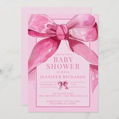 a pink baby shower card with a bow on it