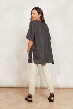 STYLE DETAILS: Enjoy carefree summer days in style with the Halcyon Relaxed Top, crafted from 100% linen. Its relaxed fit and contemporary tunic design, featuring high-side vents, ensure you stay cool and comfortable all season long. Pair it with matching linen shorts or loose pants for an effortless look perfect for soaking up the sun and embracing those relaxed summer vibes. FEATURES: Round neck Elbow-length sleeves Patch pocket High side vents Relaxed fit 100% Linen One Size Tunic Designs, Linen Bottoms, Unique Fits, Loose Pants, Mid Dresses, Denim Jean Jacket, Mid Length Dresses, Linen Shorts, Skirt Leggings