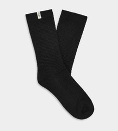 Made from a lightweight Merino blend, this breathable sock is designed to wick moisture, enhancing the wearing experience of our sheepskin boots. | Perfect crew sock to wear with your favorite UGG® Sheepskin boot. Merino Wool Blend - 51% Nylon/25% Polyester/15% Acrylic/8% Wool/1% Elastane. 9 1/2 inch height. Soft twill tape with The UGG® Logo on top cuff. Fits shoe size: 5-10. Imported. | UGG® Women's Classic Boot Sock II Sheepskin Socks in Black Black Warm Socks, Black Fall Outdoor Socks, Black Outdoor Socks For Fall, Comfortable Midweight Black Socks, Comfortable Black Cushioned Socks, Comfortable Black Socks, Ugg Accessories, Pyjamas Womens, Black Uggs