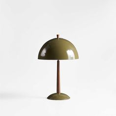 a green table lamp with a wooden base on a white background in the shape of a dome