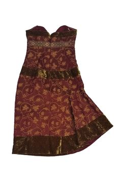 This enchanting dress is make in a red satin fabric with a gold paisley print. Trimmed with embroidery and velvet accents, this dress is bound to wow. Looks great paired with gold-tone accessories. Size 8 55% rayon, 45% silk Made in U.S.A Strapless Back zipper Sweet heart neckline Gold velvet trim Paisley print Embroidered trim below bust Empire waist Lined Bust 32" Waist 28" Shoulder to hem 37.5" Red Fitted Brocade Dress, Gold Velvet Dress For Festive Occasions, Gold Velvet Party Dress, Gold Velvet Evening Dress, Festive Red Brocade Dress, Elegant Velvet Dress For Fancy Occasions, Elegant Evening Festival Dresses, Elegant Sleeveless Festival Dress, Elegant Evening Dresses For Festivals