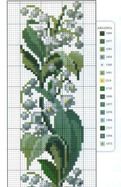 a cross stitch pattern with white flowers and green leaves