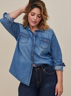 Versatile, comfortable and a closet staple, a medium wash denim shirt has a refined fit that's designed to flatter. Medium-wash denim. Spread collar. Front button closure. Button-flap chest pockets. Shirttail hem. CONTENT + CARE Cotton. Wash cold; dry low. Imported plus size tops. SIZE+ FIT Model is 5'10”, size 1. Size 2 measures 29” from shoulder. The best plus size women's taylor medium wash denim button-down shirt the in medium wash denim made of denim. You'll want to wear these basics every Spring Capsule 2023, Closet Rebuild, Dark Denim Shirt, Street Style Plus Size, Skirts Plus Size, My First Apartment, Plus Size Denim, Maxi Skirt Dress, Cute Blouses