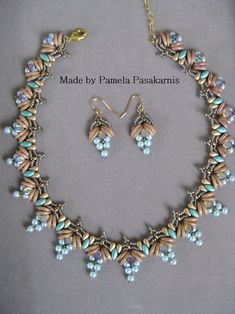 a necklace and earring set made with beads