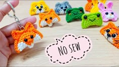 there are many small crocheted animals being held by someone's hand with the word no sew on it