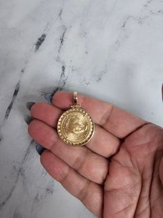 ♥ Coin Information ♥ Coin Metal: 22K Fine GoldMetal Content: 1/4OZ Fine GoldDenomination: $10Obverse: Lady Liberty Holding Branch & TorchReverse: Flying Eagle Year: Varies♥ Bezel Information ♥ Main Stone: DiamondApprox. Diamond Carat Weight: 1.36cttwDiamond Clarity: SI1/SI2Diamond Color: G/HSetting Material: 14k Yellow GoldDimensions: 39MM X 27MMTotal Weight: 14 grams**All Coins are Real Authentic Genuine Uncirculated Fine Gold CoinsAll our Diamonds are Natural. Not enhanced, simulated or lab-gr Luxury Gold Coin Necklace Tarnish Resistant, Luxury Gold-plated Coin Necklace With Round Pendant, Luxury Gold Plated Coin Necklace With Round Pendant, Luxury Gold Coin Necklace, Luxury Gold Plated Pendant Coin Necklace, Luxury 14k Yellow Gold Coin Necklace, Luxury Yellow Gold-plated Coin Necklace, Luxury Gold Plated Coin Necklace, Gold Coin Jewelry For Anniversary