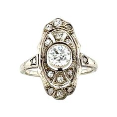 an antique style diamond ring on a white background