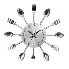 a clock with forks and spoons on the face is shown in black and white