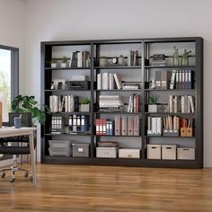 a large bookcase filled with lots of books on top of a hard wood floor