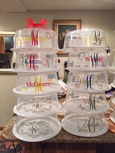 there are many plates stacked on top of each other with the letters mr and mrs painted on them