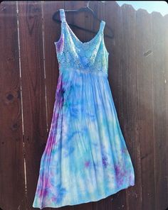 Experience the epitome of summer comfort and  hip bohemian style with this lightweight, flowy summer dress. Sleeveless with delicate straps, this dress is crafted from breathable rayon and cotton lace, with a hint of viscose and spandex for the perfect amount of stretch and comfort. Ice dyed in cool, soothing shades of blue and purple, this dress is as eye-catching as it is comfortable.  Whether you're heading to a festival, a party, or just the local farmer's market on the weekend, this dress is your go-to choice for any occasion. In a size medium, it measures 47 inches from strap to bottom and 33 inches from the hem under the bust to the bottom, so depending on your height it should hit you mid calf, possibly longer. Embrace summer with this effortlessly chic and versatile summer dress. Summer Beach Tie-dye Dress, Flowy Tie-dye Beach Dress, Spring Hand-dyed Tie Dye Dresses, Hippie Tie-dye Summer Dresses, Flowy Tie-dye Summer Maxi Dress, Flowy Summer Dresses, Boho Summer Dresses, Ice Dyeing, Boho Summer