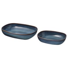 two blue bowls sitting next to each other