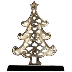 a metal christmas tree on a black stand