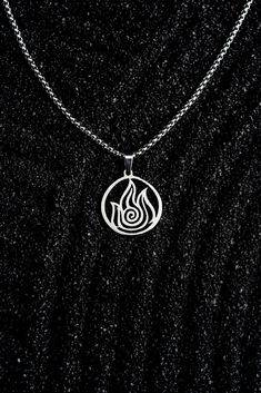 FIRE🔥 The strongest of the four nations, we hope this pendant helps the wearer tap into the powerful force and unflinching will that make fire benders so impressive. Materials: Stainless steel, comes with a 2mm rounded box chain. Pendant dimensions: Approx. .75" by .75" Fire Jewelry Design, Fire Necklace, Golden Pendant, Fire Jewelry, 4 Elements, Fire Nation, Symbol Necklace, Round Box, Aang