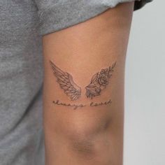 a woman with a tattoo on her arm that reads, always be brave and has two wings