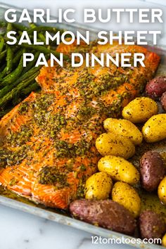 salmon, potatoes and asparagus in a pan with the title garlic butter salmon sheet pan dinner