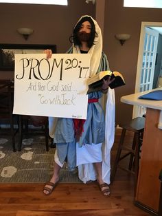 a man dressed as jesus holding a sign that says prop 29 th and then god said go with it