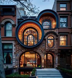 a large brick building with arched windows and steps leading up to the front entrance area