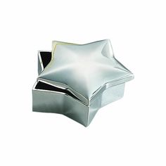 a silver star shaped box on a white background