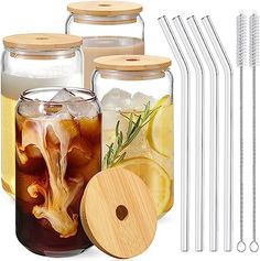 the mason jars are filled with drinks and drinking straws