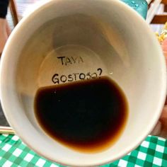 a coffee cup with the word tava gosita written on it