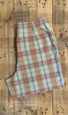 "Awesome high waisted 90's plaid shorts. High waisted fit, looser through the hips, and two front pockets. Button and zipper closure in front. Classic 90's multi colored plaid pattern. Shorts are in excellent clean condition. Measurements are taken zipped or buttoned up and laid comfortably flat then x 2 for total circumference (inches) Liz Claiborne Tag Size 10 100% Cotton Waist 28\" Hips 42\" Length 16.5\" Inseam 5\" Rise 12\" Bottom leg Opening Circumference 26\" All items are free of rips, t Cheap Plaid Shorts, Gingham Short Bottoms With Pockets, Gingham Bottoms With Pockets, Gingham Bottoms With Pockets, Short Style, Gingham Bottoms With Pockets In Short Shape, Casual Gingham Shorts With Pockets, Retro Plaid Bottoms With Pockets, Gingham Shorts With Pockets, Fitted Casual Plaid Shorts