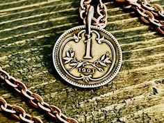 "Are you looking for a unique and personal gift? Look no further than our Austria coin pendant!  Whether it's your friend, family member, or loved one, this necklace is sure to please. Give the gift of collectable coin jewelry today!   Choose Your Year  ** Any of my Necklace Pendants can be made in a Keychain. Message me to request this necklace to be a Keychain for the same price. A small piece of a place you visited, or your home country. Looking for that special piece of jewelry that connects you to the past, look no further.  A small piece of history filled with memories from its travels around the world. Nice gift for a friend. And a great conversation starter.  Each coin has been cleaned, polished to a high shine. Comes with a 24\" chain. Two coats of protective sealer have been appl Antique Stamped Necklace Gift, Antique Coin Pendant Necklace As Gift, Antique Engraved Charm Necklaces For Gift, Antique Personalized Necklaces For Mother's Day, Personalized Antique Necklaces For Mother's Day, Antique Charm Necklace With Round Pendant For Gift, Antique Round Pendant Charm Necklace As Gift, Medallion Necklace Gift With Soldered Details, Personalized Antique Necklace For Mother's Day