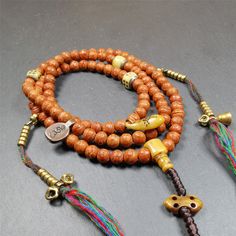 ❤This bodhi beads mala is made by Tibetan craftsmen and come from Hepo Town, Baiyu County, the birthplace of the famous Tibetan handicrafts,about 30 years old, hold and blessed by a lama in Baiyu Monastery.It is composed of 108 bodhi seed beads, and is equipped with 3 yak beads,copper bead counters are installed on both sides, 1 copper bead clip, 1 bone pendant bead,and finally consists a bone vajra on the end, very elegant.❤Details1. Handmade 108 bodhi beads approximately 8mm,mala's perimeter i Tibetan Mantra, Beads Mala, Bone Pendant, Bell Pendant, 30 Years Old, Mala Beads, Prayer Beads, 30 Years, Seed Beads