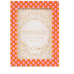 an orange and pink photo frame with the words shirbaah chicago in gold on it