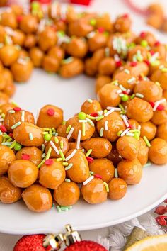 a white plate topped with food covered in sprinkles