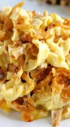 pasta with meat and cheese on a white plate