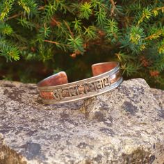 Introducing our Handmade Mantra Bracelets, lovingly crafted in Nepal by skilled artisans who have brought our vision to life. Elevate your style with these timeless accessories that seamlessly merge the essence of hippie and boho aesthetics, designed for free-spirited souls. 🌿 PRODUCT DETAILS: - Handcrafted in Nepal - Made from Copper, Brass and Pewter (tin, copper, antimony alloy) - Unisex design, perfect for all - Free size and adjustable for a comfortable fit 🌿 UNLOCK THE POWER OF "OM NAMAH Symbolic Round Cuff Bracelet Gift, Traditional Handmade Bangle As Gift, Artisan Handmade Bracelets For Meditation, Handmade Spiritual Bangle As A Gift, Handmade Spiritual Bangle For Gift, Bohemian Stamped Cuff Bracelet For Gift, Bohemian Stamped Cuff Bracelet Gift, Artisan Engraved Bracelets As Gift, Artisan Engraved Bracelets For Gifts