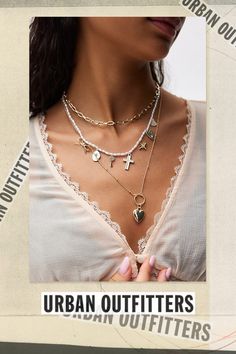 Set of three necklaces that layer together for a coquette look. Features Larsa layered charm necklace set Set of three necklaces Layer them together or wear on their own Adjustable length Content + Care Set of 3 Mixed metal, glass Avoid contact with water Imported Size Dimensions: 16" -18" l + extender | Larsa Layered Charm Necklace Set in Gold, Women's at Urban Outfitters Gold Necklace From Urban Outfitters As A Gift, Urban Outfitters Gold Necklace As A Gift, Trendy Urban Outfitters Jewelry As Gift, White Charm Necklaces For Layering, Three Necklaces, Mixed Metals, Layered Necklaces, Necklace Set, Charm Necklace