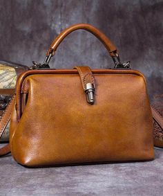 Art Brown Durable Calf Leather Satchel HandbagThis bag is made of fine Calf Leather fabric.Measurement: 22cm/8.58" * 14.2cm/5.538" * 8cm/3.12"Zip up closure. Inside pockets. Retro Handheld Box Bag, Retro Leather Box Bag For Travel, Retro Leather Top Handle Box Bag, Retro Leather Box Bag With Top Handle, Retro Style Crossbody Bag For Office, Retro Crossbody Bag For Office, Retro Handheld Bag, Retro Leather Satchel Box Bag, Retro Leather Box Bag For Daily Use