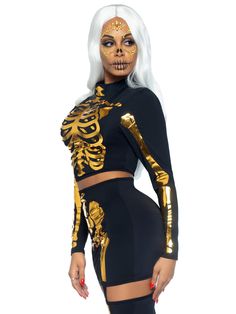 You'll be the sexiest skeleton in the graveyard in the party-ready Leg Avenue 2-Piece Golden Skeleton Set. The gold ghoul outfit set features a long sleeved crop top and garter skirt and laser cut skeleton design. Stunning a stunning silhouette in the curve-hugging crop top and matching high waist skirt with eye catching garters and stockings. Stand out in the crowd with the sparkling gold skeleton design. For festival ready look, pair this sexy skeleton set with the Leg Avenue Mystic Adhesive F Ghoul Outfit, Golden Skeleton, Leg Avenue Costumes, Garter Skirt, Skeleton Halloween Costume, Sleeved Crop Top, Garters And Stockings, Platform Boots Chunky, Skeleton Costume