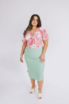 This PLUS SIZE Moth To A Flame Skirt features a trendy sage hue, textured detailing, and an elasticized high waist for added comfort. Lightweight and semi-stretchy, it's perfectly styled for the new season with a midi length and unlined, non-sheer design. A cute, girlish must-have! Details Textured fabric Elastic waistband Semi-stretchy Unlined Sizing Approximate measurements: SIZE LENGTH WAIST 1XL 35” 33” 2XL 36” 36” 3XL 37” 37” Fits true to size Fabric has stretch Model is 5’6” wearing 1XL Mat Feminine Fitted Green Skirt, Fitted Green Feminine Skirt, Fitted Feminine Green Skirt, Spring Green Bottoms For Brunch, Moth To A Flame, Textured Fabric, New Season, Midi Length, Moth